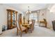 Elegant dining room with classic wooden furniture and a decorative china cabinet at 5134 S Ouray Ct, Centennial, CO 80015