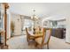Bright dining room with a wooden table, chandelier, and ample natural light at 5134 S Ouray Ct, Centennial, CO 80015