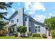 Charming home with blue siding, a well-maintained lawn, a backyard patio, and mature trees at 5134 S Ouray Ct, Centennial, CO 80015