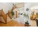 Spacious foyer with hardwood floors, a staircase, and views of the living and dining areas at 5134 S Ouray Ct, Centennial, CO 80015