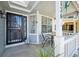 Covered front porch with seating area, perfect for enjoying the outdoors at 5134 S Ouray Ct, Centennial, CO 80015