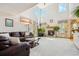 Bright and spacious living room with vaulted ceilings and a fireplace, perfect for entertaining at 5134 S Ouray Ct, Centennial, CO 80015