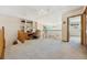 Upstairs loft featuring built-in shelves, desk, wood railing, and carpet at 5134 S Ouray Ct, Centennial, CO 80015