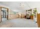 Bright loft featuring wood railing, carpet, built-in shelves and adjacent bedrooms at 5134 S Ouray Ct, Centennial, CO 80015