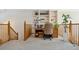 Upstairs office with built-in shelves, desk and natural lighting at 5134 S Ouray Ct, Centennial, CO 80015