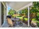 Outdoor patio area with a round table, chairs, and a view of the landscaped backyard at 5134 S Ouray Ct, Centennial, CO 80015
