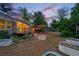 Landscaped backyard featuring raised garden beds, a deck, and a pergola-covered patio for entertaining at 9390 W 14Th Ave, Lakewood, CO 80215