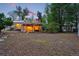Expansive backyard with a pergola-covered patio, a storage shed, and ample space for outdoor activities at 9390 W 14Th Ave, Lakewood, CO 80215
