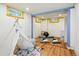 Basement featuring an open space with a play teepee, blue support beams and two small windows at 9390 W 14Th Ave, Lakewood, CO 80215