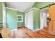 View of the bedroom featuring green walls, a skylight, and an attached closet space at 9390 W 14Th Ave, Lakewood, CO 80215