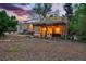 Charming home featuring an inviting pergola-covered patio, solar panels, and a spacious mulch yard at 9390 W 14Th Ave, Lakewood, CO 80215