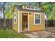 Exterior of the shed with an open door showing a desk and chair inside at 9390 W 14Th Ave, Lakewood, CO 80215