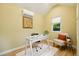 Interior of the shed features a desk, chair, rug, and modern decor at 9390 W 14Th Ave, Lakewood, CO 80215