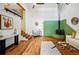 Spacious living room features vaulted ceilings, wood beams, and access to the kitchen at 9390 W 14Th Ave, Lakewood, CO 80215