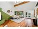 Spacious living room features vaulted ceilings, wood beams, and access to the backyard at 9390 W 14Th Ave, Lakewood, CO 80215