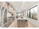 Modern kitchen with stainless steel appliances and an island at 2393 King St, Denver, CO 80211