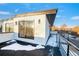 Modern rooftop deck with city views and snow-covered surface at 2393 King St, Denver, CO 80211