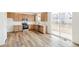 Modern kitchen features stainless steel appliances and light wood cabinets at 13402 E 110Th Way, Commerce City, CO 80022