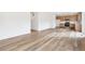Spacious living area with wood-look floors and an open layout at 13402 E 110Th Way, Commerce City, CO 80022