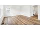 Living room with large windows and wood-look flooring at 13402 E 110Th Way, Commerce City, CO 80022