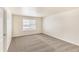 Bedroom with carpet flooring, neutral walls, and a large window at 816 Leeward St, Lochbuie, CO 80603