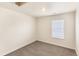 Carpeted bedroom with neutral paint, a window with blinds, and ample natural light at 816 Leeward St, Lochbuie, CO 80603