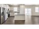 Modern kitchen with granite countertops, stainless steel appliances, and center island at 816 Leeward St, Lochbuie, CO 80603