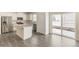 Modern kitchen with granite countertops, stainless steel appliances, and a kitchen island at 816 Leeward St, Lochbuie, CO 80603