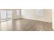 Open floor plan living room with wood floors and plenty of natural light at 816 Leeward St, Lochbuie, CO 80603