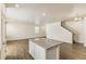 Spacious living room with hardwood floors, recessed lighting, neutral walls, and an open floor plan at 816 Leeward St, Lochbuie, CO 80603