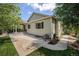 Back of the house featuring a patio and well-manicured lawn at 3406 Quicksilver Rd, Frederick, CO 80516