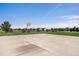 Outdoor basketball court offers recreational space for residents of the community with lush greenery at 3406 Quicksilver Rd, Frederick, CO 80516