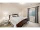 A cozy bedroom with a large window and ample light at 3406 Quicksilver Rd, Frederick, CO 80516