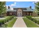The community clubhouse offers a welcoming entrance, a concrete walkway, and well-maintained lawns at 3406 Quicksilver Rd, Frederick, CO 80516