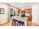 Kitchen island features granite countertops, pendant lighting, and barstool seating at 3406 Quicksilver Rd, Frederick, CO 80516