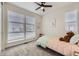 Bright bedroom with large windows and a cozy bed, perfect for relaxing at 5134 Queen Ct, Arvada, CO 80002