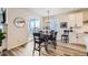 Cozy dining area with modern light fixture and sliding door access to the outdoors at 5134 Queen Ct, Arvada, CO 80002