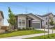 Charming home with a two-car garage, stone accents, and well-maintained landscaping at 5134 Queen Ct, Arvada, CO 80002