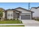 Charming single-Gathering home with a well-maintained lawn and inviting stone accents at 5134 Queen Ct, Arvada, CO 80002