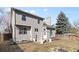 Backyard with landscaping, patio and partial view of the back of home at 96 S Lindsey St, Castle Rock, CO 80104