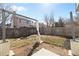 Fenced backyard with landscaping, fire pit, and pergola at 96 S Lindsey St, Castle Rock, CO 80104