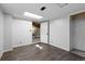 Finished basement with open door to the unfinished basement laundry area at 96 S Lindsey St, Castle Rock, CO 80104