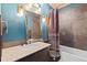 Well-lit bathroom features modern fixtures, a shower-tub combo, and stylish decor at 96 S Lindsey St, Castle Rock, CO 80104