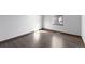 Neutral bedroom featuring an exterior view via a sunny window and hardwood floors at 96 S Lindsey St, Castle Rock, CO 80104