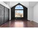 Bedroom with hardwood floors, modern window and vaulted ceiling at 96 S Lindsey St, Castle Rock, CO 80104