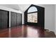 Spacious bedroom with vaulted ceiling, a large arched window and dark trim at 96 S Lindsey St, Castle Rock, CO 80104