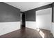 A spacious bedroom with wood floors, white trim detail and neutral paint at 96 S Lindsey St, Castle Rock, CO 80104