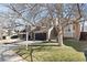 Beautiful two-story house showcasing a charming brick facade, manicured lawn, and convenient two-car garage at 96 S Lindsey St, Castle Rock, CO 80104