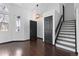 Bright foyer with vaulted ceilings, hardwood floors, and staircase to the upper level at 96 S Lindsey St, Castle Rock, CO 80104