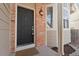 Welcoming front door with brick surround, lantern fixture, and a cozy, inviting entrance at 96 S Lindsey St, Castle Rock, CO 80104